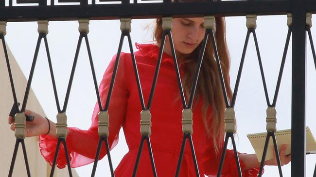 Depp and Heard were joined by an unidentified female companion on the rooftop terrace of their luxury condo at Palazzo Versace. Picture Mike Batterham