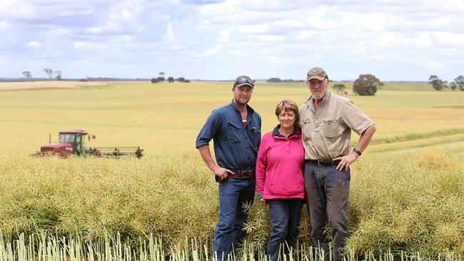 Expansion mode: Nathan Blomeley with his parents Danielle and Tim on their farm.