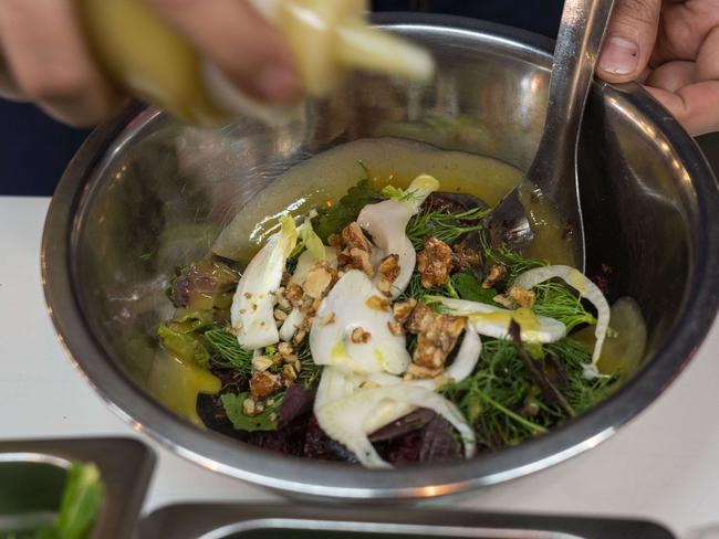 One of the dishes being plated up at Pazar Food Collective. Picture: Matthew Vasilescu