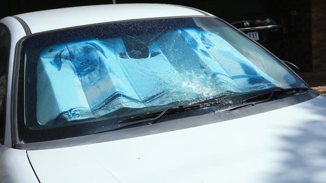 A car with a smashed windscreen at the Norlane property targeted by the gunmen. Picture: Alan Barber