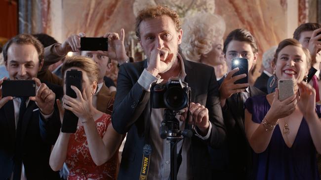 Jean-Paul Rouve as a wedding photographer in a scene from French film C'est la Vie