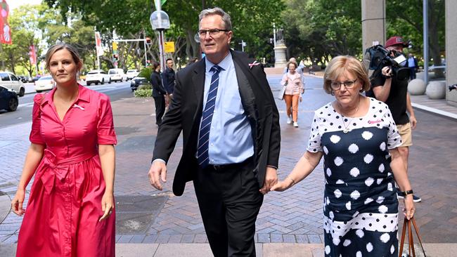 Greg Simms, the brother of murdered woman Lynette Dawson, leaves the Federal Court in Sydney on Thursday with wife Merilyn and daughter Renee. Picture: NCA NewsWire / Jeremy Piper