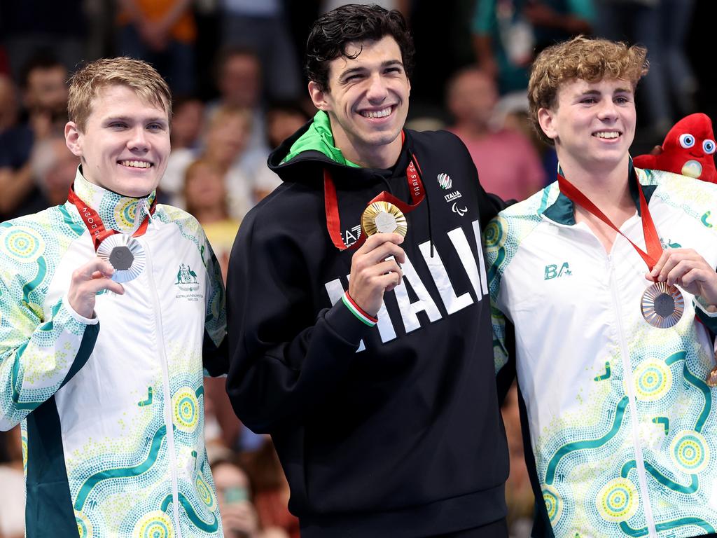 Tim Hodge (left) won silver and fellow Aussie Lewis Bishop (right) won bronze in 100m butterfly