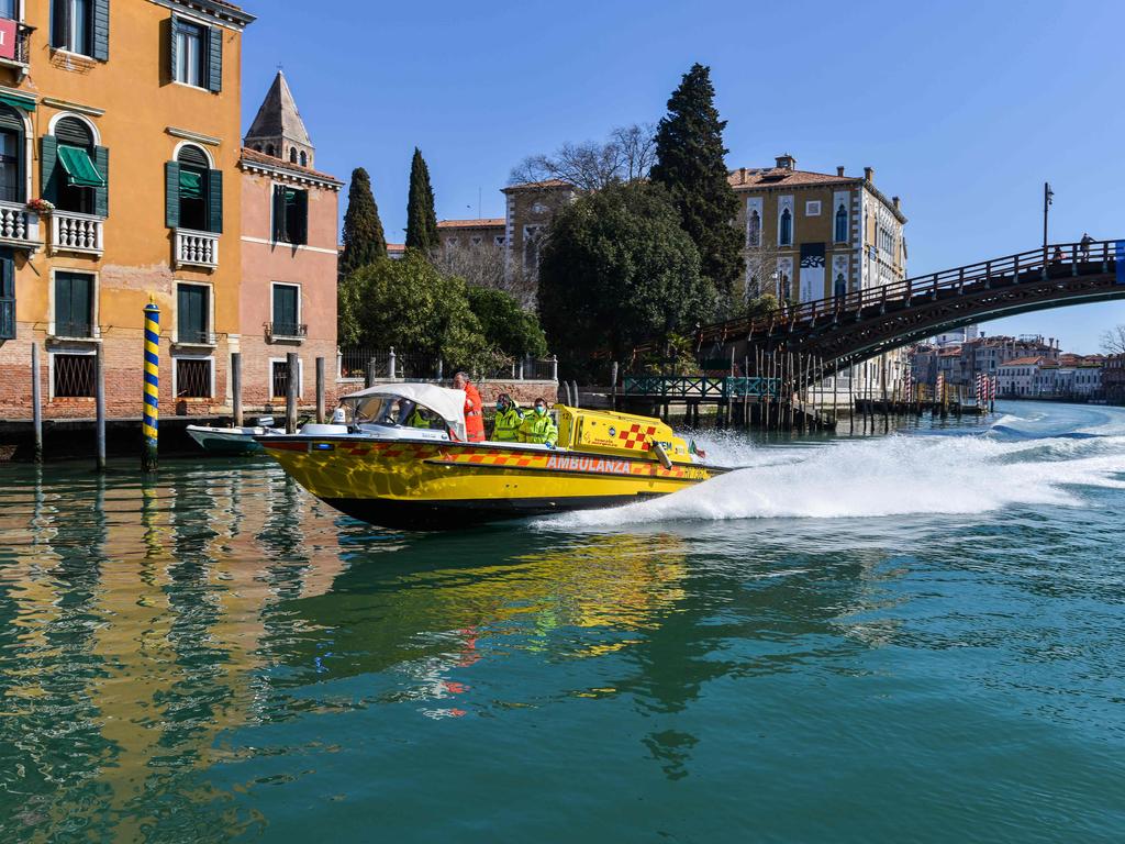 An ambulance speedboat sails through Venice where waters are clear due to a lack of tourists. Picture: ANDREA PATTARO / AFP