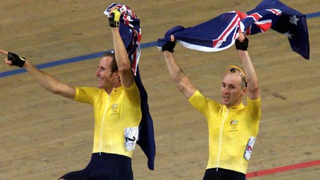 Scott McGrory and Brett Aitken celebrate winning gold in the madison at Dunc Gray Velodrome in the 2000 Sydney Olympics.