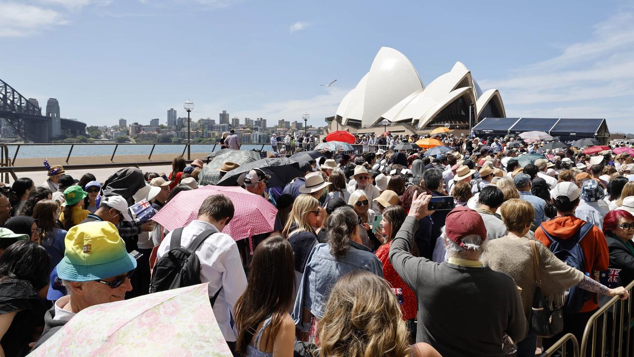 Royal fans queue up to to see the King and Queen outside the Sydney Opera House. Picture: NewsWire / Damian Shaw