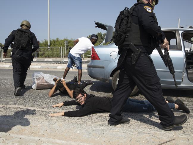 Police officers check suspects at a check point in Israel, searching for Hamas militants from the Gaza Strip. Picture: Amir Levy/Getty Images