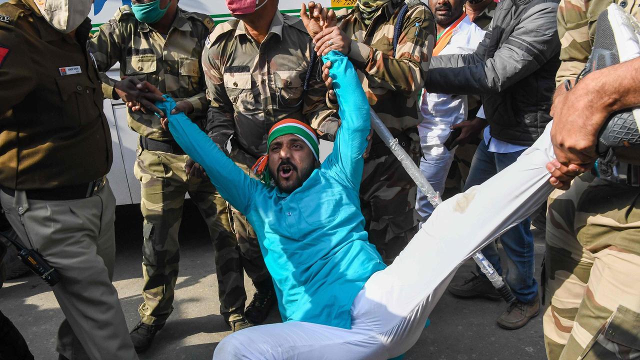 Police personnel detain Indian Youth Congress workers during a protest against the new agricultural laws, the rise of unemployment and price rise of goods and services, in New Delhi on February 9, 2021. Picture: Prakash Singh/AFP