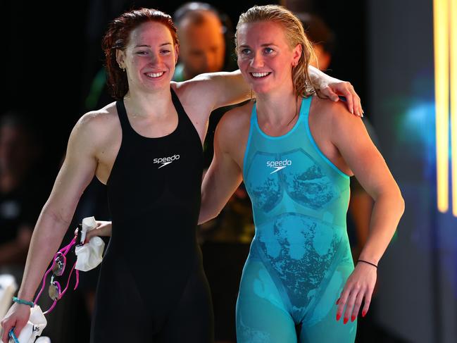 Ariarne Titmus (R) and Mollie O'Callaghan (L) embrace after 200 metre freestyle world records. Picture: Chris Hyde/Getty Images