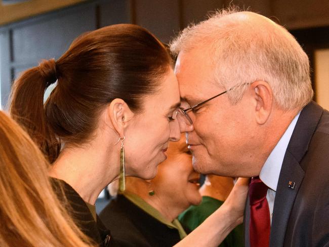 This handout picture taken and released by the Visits and Ceremonial Office of New Zealand on May 30, 2021 shows Australia's Prime Minister Scott Morrison (R) receiving a traditional "hongi" greeting from New Zealand's Prime Minister Jacinda Ardern (L) as he arrives for a welcoming ceremony during his visit in Queenstown. (Photo by Mark Tantrum / Visits and Ceremonial Office / AFP) / -----EDITORS NOTE --- RESTRICTED TO EDITORIAL USE - MANDATORY CREDIT "AFP PHOTO / VISITS AND CEREMONIAL OFFICE NEW ZEALAND / MARK TANTRUM" - NO MARKETING - NO ADVERTISING CAMPAIGNS - DISTRIBUTED AS A SERVICE TO CLIENTS