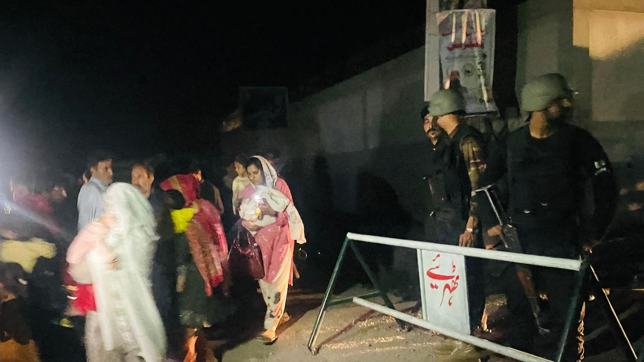 Residents evacuate their homes near the site of a strike in Muzaffarabad, the capital of Pakistan-administered Kashmir. Picture: Sajjad Qayyum/AFP