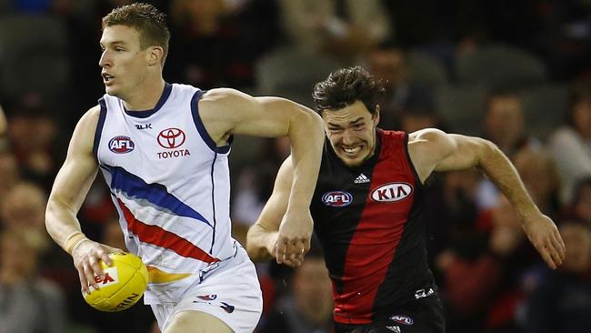 Josh Jenkins sprints away from Bomber Michael Hibberd. Jenkins has already bagged 34 goals this season. Picture: Michael Klein