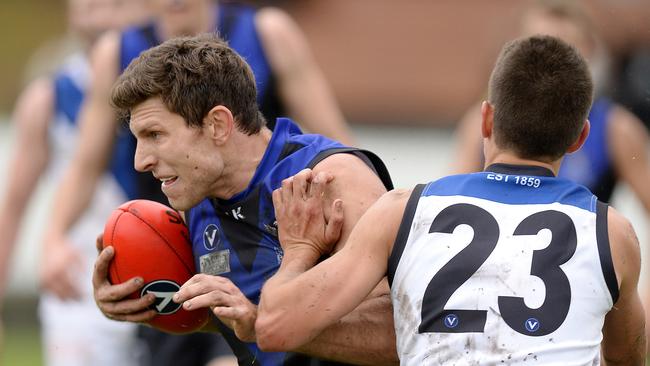 Adam Pattison feels the heat in Uni Blacks’ loss to Uni Blues. Picture: David Smith