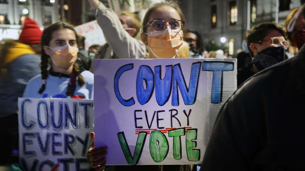 People participate in a protest in support of counting all votes on Wednesday night (local time) in Philadelphia, Pennsylvania. Picture: Spencer Platt/Getty Images/AFP