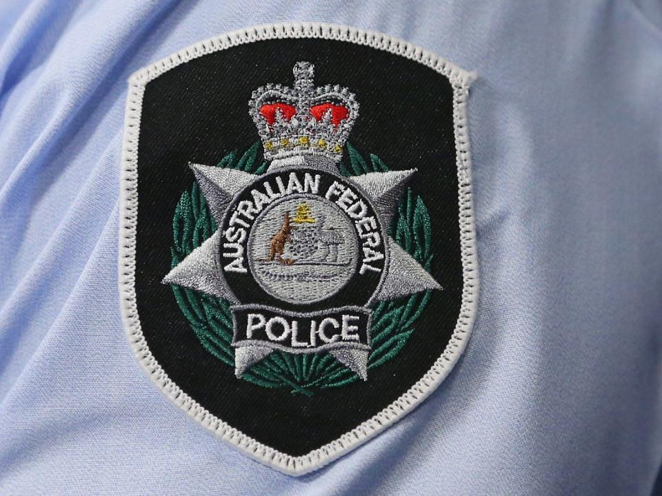 Hundreds of Australian Federal Police officers threaten to quit over pay deal