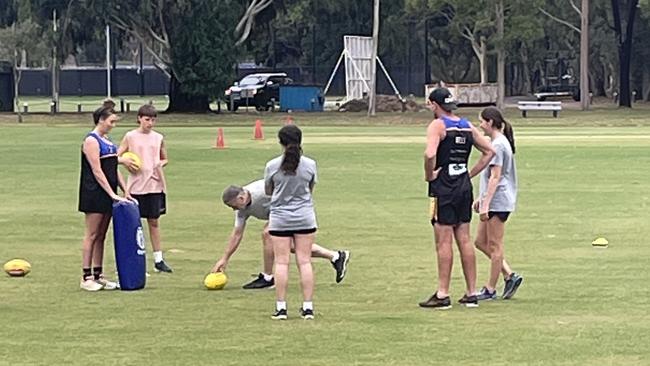 Old Carey women's football players at training. Picture: Supplied.