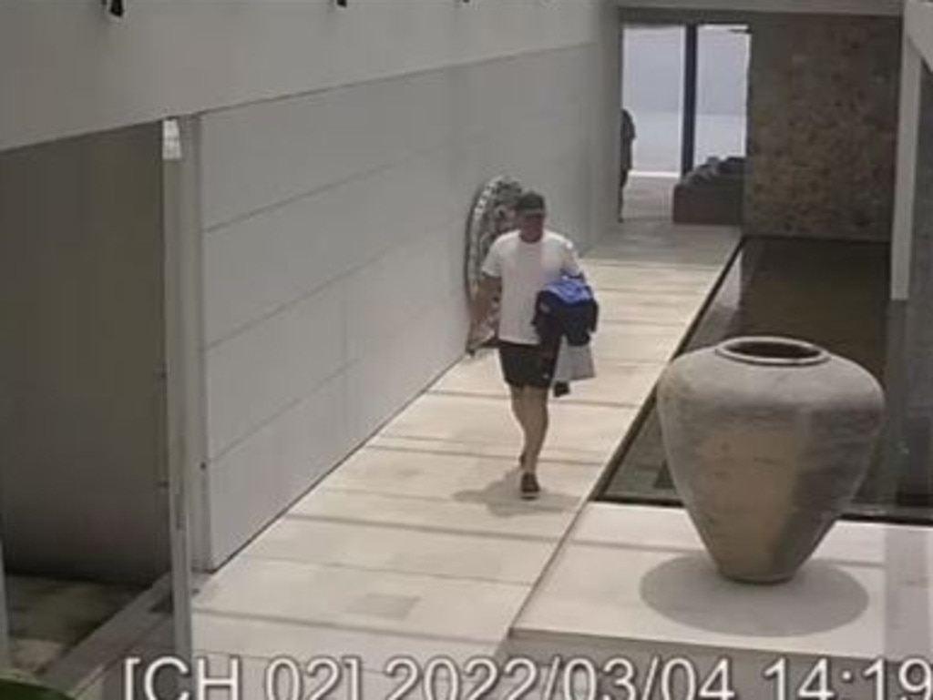 In what is thought to be the final photo of Shane Warne, the cricketer walks through his luxury villa in Thailand. Picture: CCTV