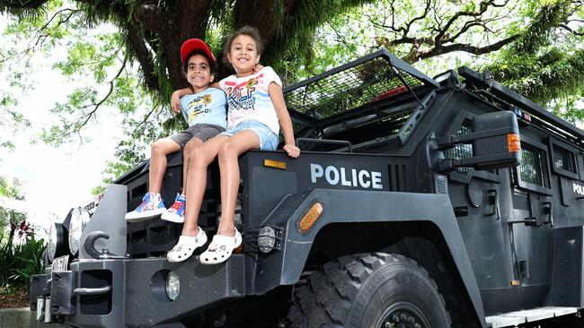 On Friday Operation Whiskey Legion officers hosted a community engagement day, where members of the public can meet the officers and get up close to police vehicles, including buggies, motorbikes, boats and the Bearcat armoured vehicle. Cousins Jairus Mara and Avaini Lewis got a good look at the Queensland Police Bearcat armoured vehicle when it was parked on the Cairns Esplanade. Picture: Brendan Radke