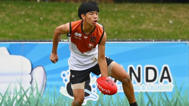 Hau-Tze Rock of the Northern Territory handballs during the AFL 2024 Under 16 Boys Championships match between Northern Territory and Tasmania at Trevor Barker Beach Oval on June 8, 2024 in Melbourne, Australia. Picture: Morgan Hancock/AFL Photos