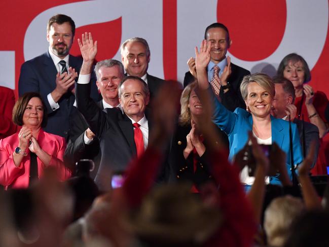 Australian Opposition Leader Bill Shorten (left) and Deputy Opposition Leader Tanya Plibersek (right) are seen waving to supporters at the launch of Labor's federal election campaign at the Brisbane Convention and Exhibition Centre in Brisbane, Sunday, May 5, 2019. A Federal election will be held in Australia on Saturday May 18, 2019 (AAP Image/Darren England) NO ARCHIVING