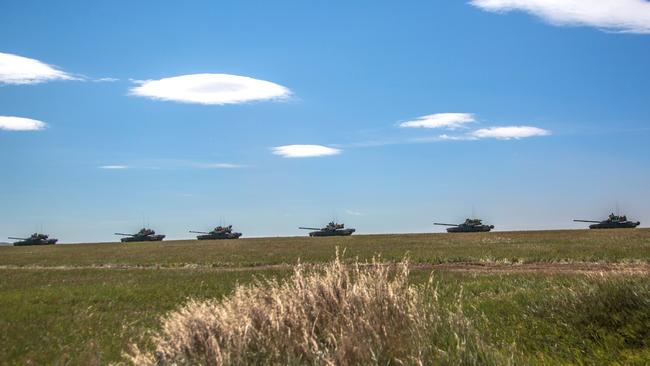 Russian tanks roll down a road in Eastern Siberia. Picture: Russian Defence Ministry via AP