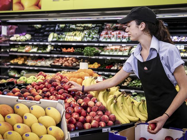 REFRESH: Luca Rungie re-stocks produce at Hahndorf IGA. Picture: Mike Burton