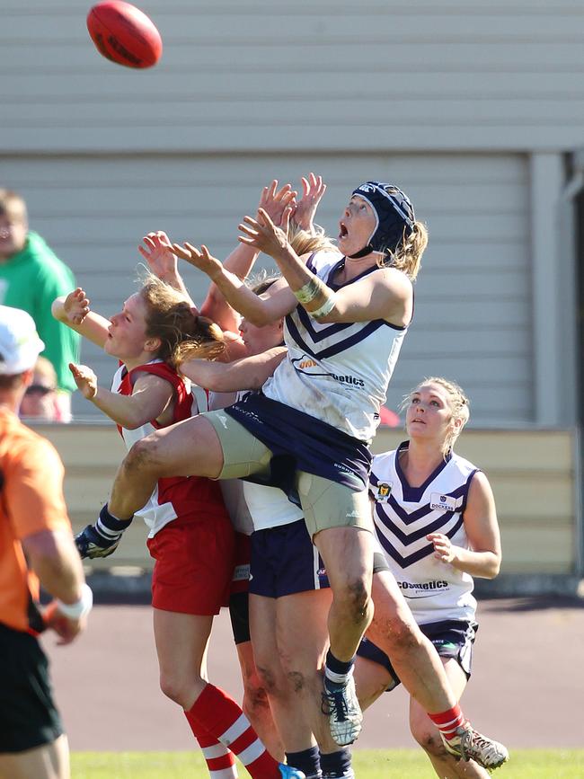 Burnie's Britt Gibson takes a strong mark against Clarence at Devonport.