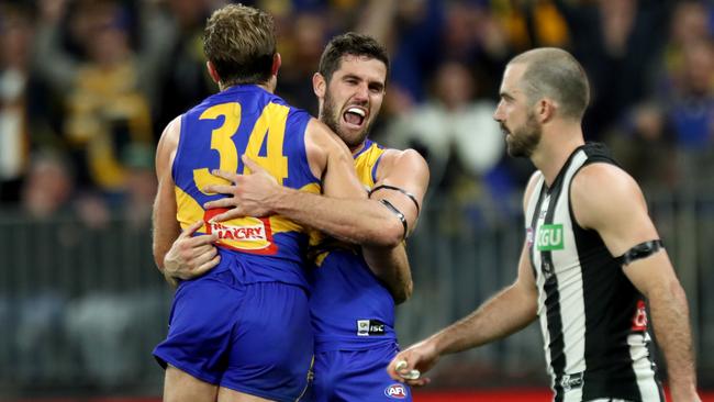 Jack Darling and Mark Hutchings celebrate a goal in front of Steele Sidebottom.