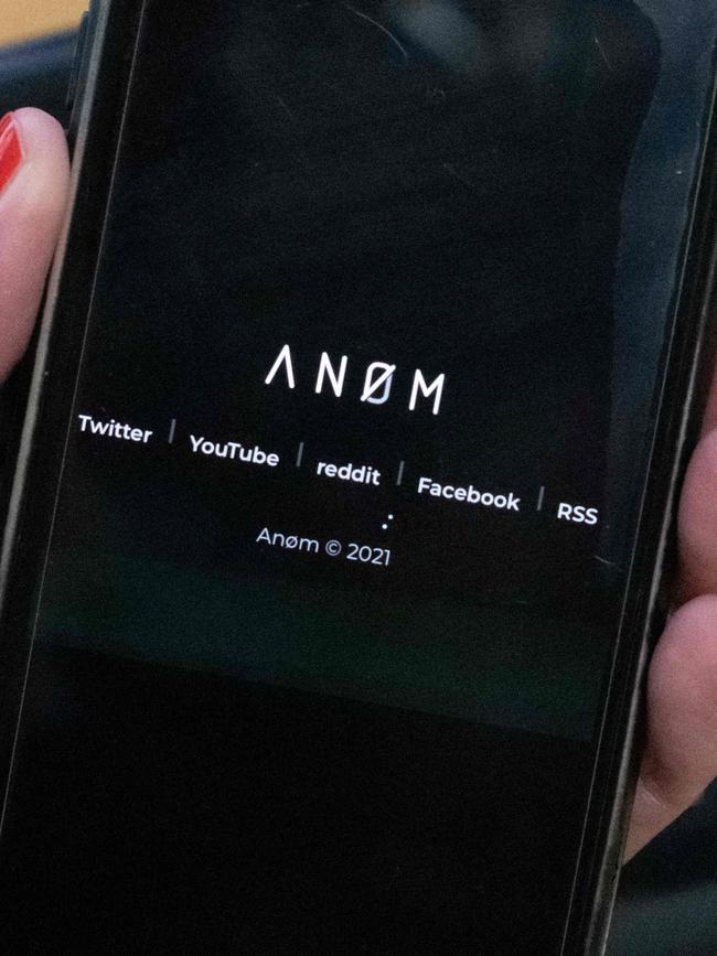 The AN0M logo on the screen of a smartphone. Picture: Olivier Morin/AFP