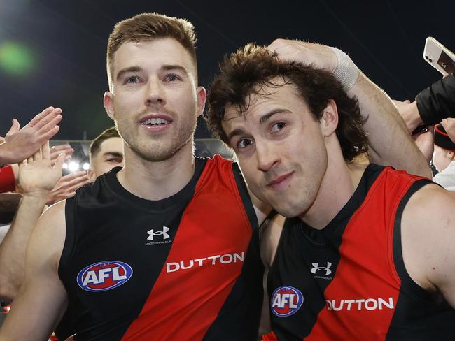 NCA . MELBOURNE, AUSTRALIAÃ July 5 , 2024.  AFL  Round 17. Collingwood vs Essendon at the MCG.   Zach Merrett , captain of the Bombers  and Andrew McGrath , who played his 150th game led the team off the MCG    . Pic: Michael Klein