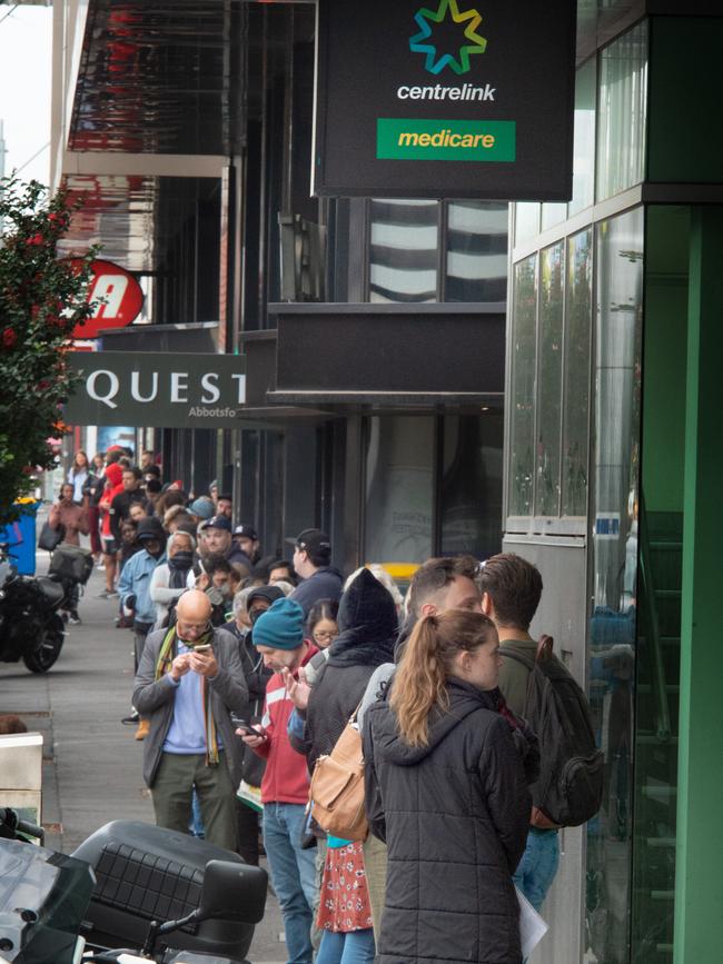 Large queues line up at the Abbotsford Centrelink during Coronavirus shutdown. Picture: Tony Gough