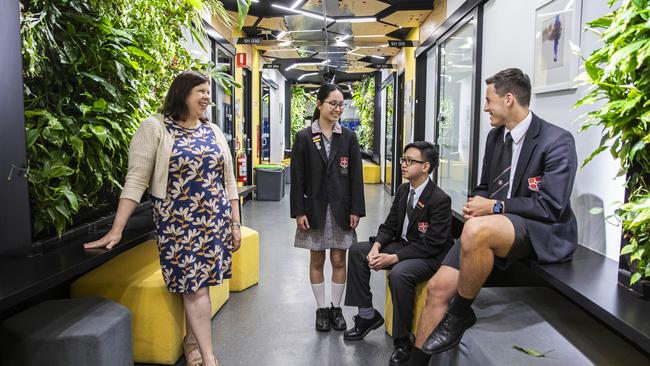 Caroline Chisholm Catholic College deputy principal Stephanie Banks with Nhi Nguyen, Christian Nguyen and Lachlan Meilak at the Braybrook campus. Picture: Aaron Francis