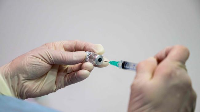 A nurse fills a syringe with the Pfizer vaccine. Picture: Thomas Lohnes/AFP