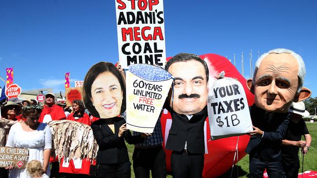 Protesters make their feelings on Adani known on the lawns of Parliament House in Canberra. Photo: Kym Smith