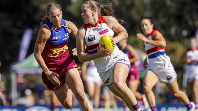 Kate Lutkins (left) of the Lions chases down Isabel Huntington (right) of the Bulldogs during the Round 2 AFLW match between the Brisbane Lions and the Western Bulldogs at the South Pine Sports Complex in Brisbane, Sunday, February 11, 2018. (AAP Image/Glenn Hunt) NO ARCHIVING, EDITORIAL USE ONLY