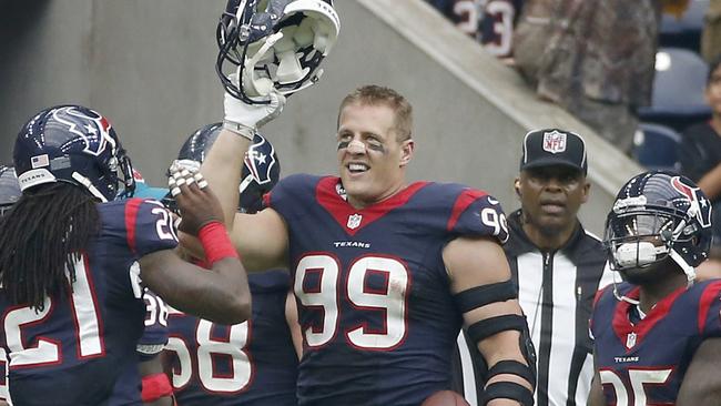 J.J. Watt celebrates after returning an interception for an 80 yard touchdown.