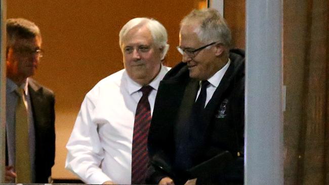 DAILY TELEGRAPH SPECIAL: Clive Palmer and Malcolm Turnbull leave the Wild Duck Chinese restaurant in Canberra as Treasury Secretary Martin Parkinson holds back in the shadows.(note: Photographs taken Wed.May 28th 2014)