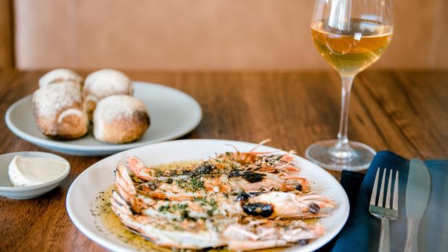 Barbecue king prawns, prawn butter, capers, parsley and bread, a summer offering at Restaurant Labart, Burleigh Heads.