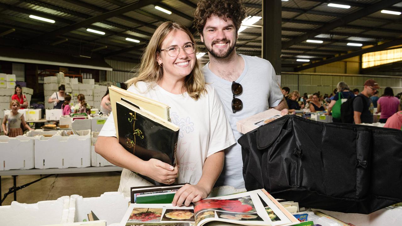 Belle Clark and Darby Waters check out The Chronicle Lifeline Bookfest after recently relocating to the city, Saturday, March 1, 2025. Picture: Kevin Farmer