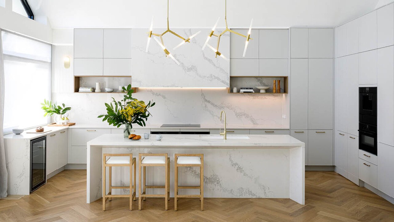 A contemporary pendant light over this Kinsman kitchen makes the space polished.