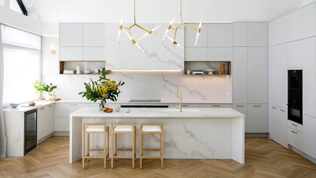 A contemporary pendant light over this Kinsman kitchen makes the space polished.