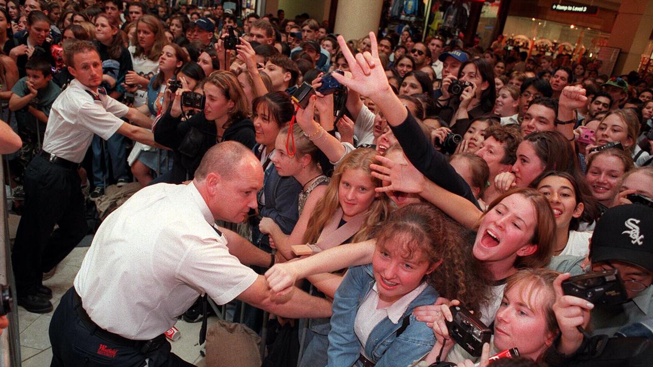 Security guards control hundreds of teenage fans to see Matt LeBlanc and his co-star Lacey Chabert.