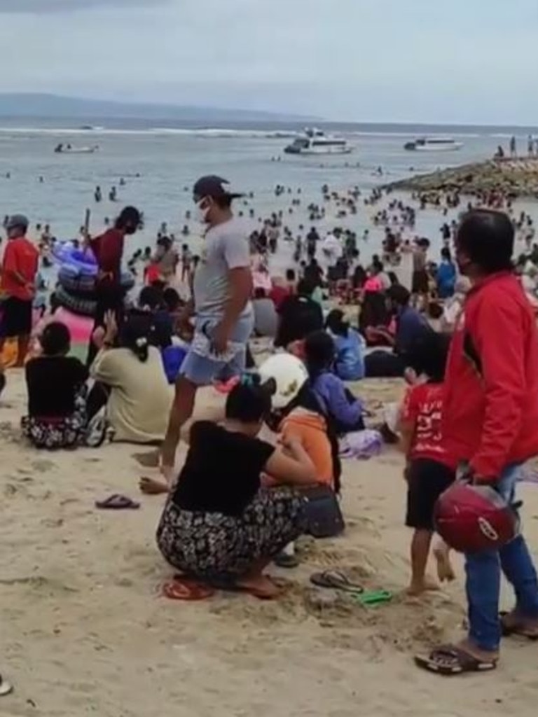 Hundreds of locals and domestic tourists visit the beaches in Bali.