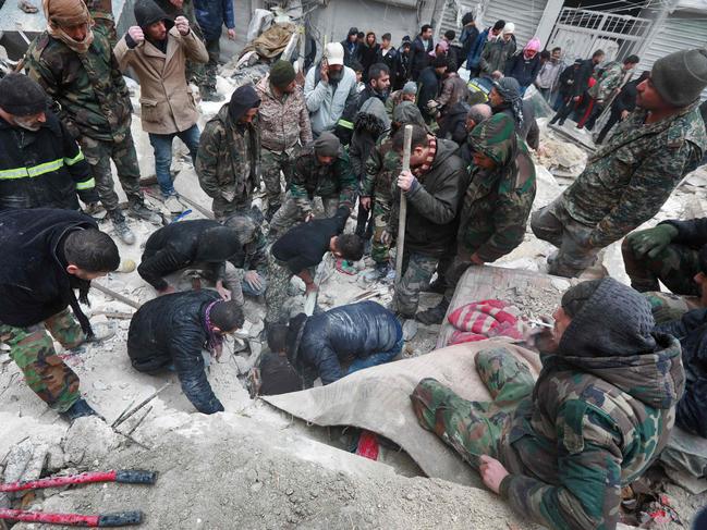 Syrian rescue teams search for victims and survivors at the rubble a collapsed building in the city of Aleppo in Syria. Picture: AFP