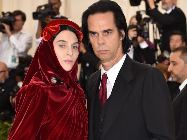 Susie Cave and Nick Cave arrive for the 2018 Met Gala on May 7, 2018, at the Metropolitan Museum of Art in New York. The Gala raises money for the Metropolitan Museum of Art’s Costume Institute. The Gala's 2018 theme is “Heavenly Bodies: Fashion and the Catholic Imagination.” / AFP PHOTO / Hector RETAMAL