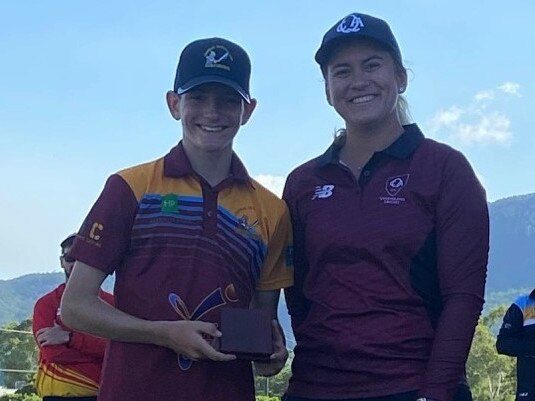 CQ Centurions under-14 all-rounder Fraser Judd receives the George Mitchell Medal for Player of the Carnival from Queensland Cricket's Zoe Eisenmenger.