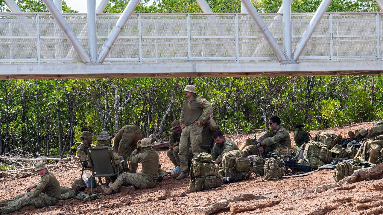 Australian soldiers await a barge. Picture: Pema Tamang Pakhrin