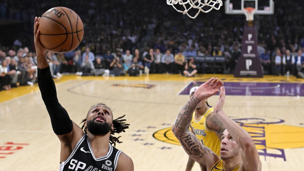 San Antonio Spurs guard Patty Mills, left, of Australia, shoots as Los Angeles Lakers guard Lonzo Ball defends. Picture: AP