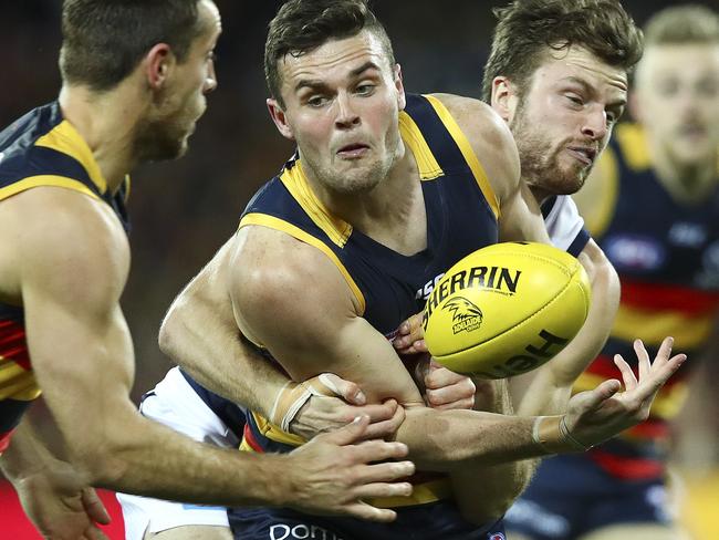 AFL - Adelaide Crows v Geelong - Round 18 - Adelaide Oval. Brad Crouch passes off to Richard Douglas. Picture Sarah Reed