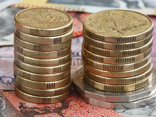 Australian coins set on a background of Australian notesTo see a range of Australian themed images please visit this lightbox, money generic